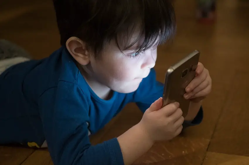 boy holding smartphone