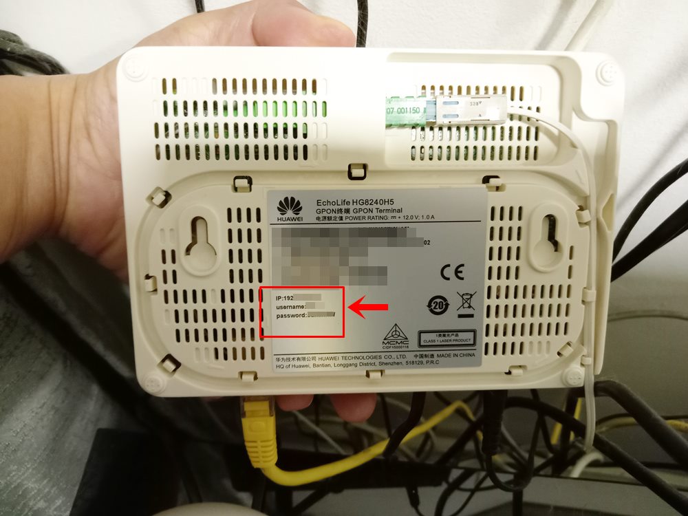 How to Reset Wi-Fi Password: This photo depicts the bottom of a router with its IP address, username and password on the manufacturer