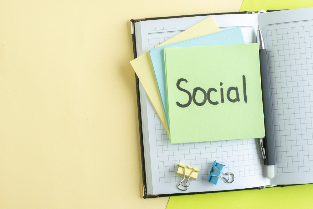 This photo depicts a diary with some Post-its that are written with the word 