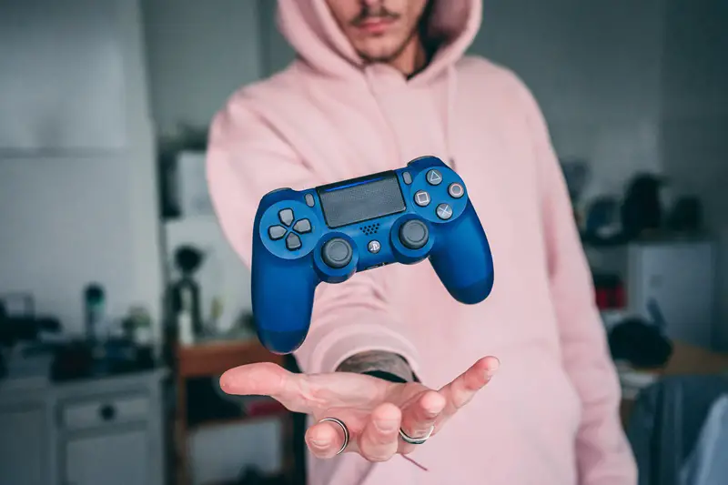 game controller levitate in a man's hand