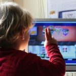 kid playing computer games