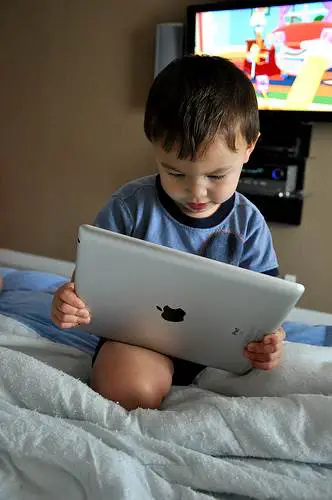 kid with iPad