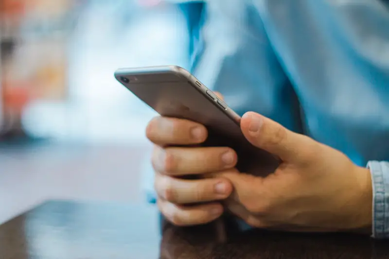 person holding phone in hands