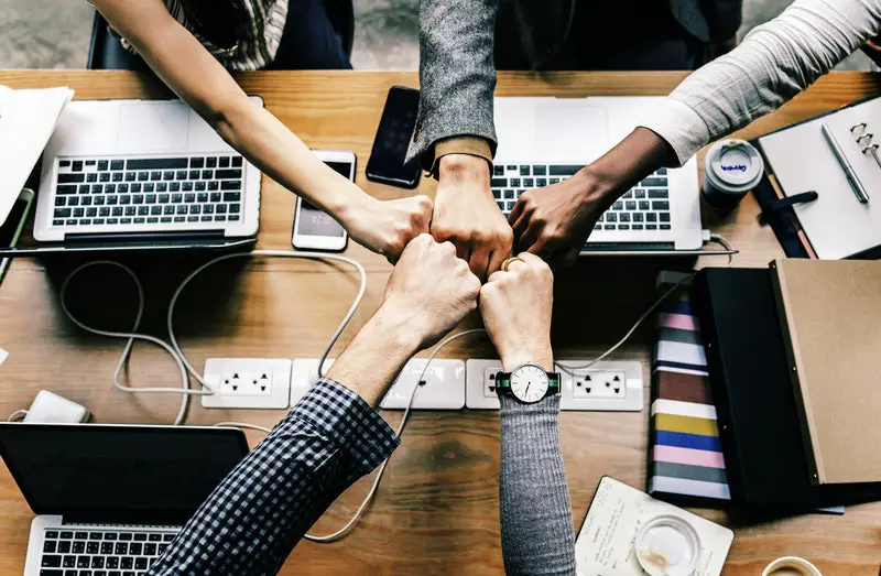 group-hand-fist-bump