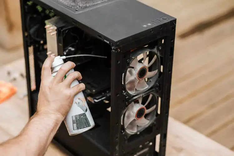 remove dust in computer with compressed air