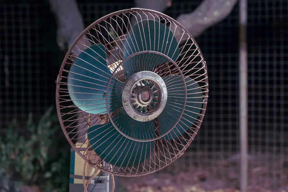 A fan gently circulates air, which aids in the natural drying process. Place your wet phone in front of a fan, ensuring there's good airflow around it.