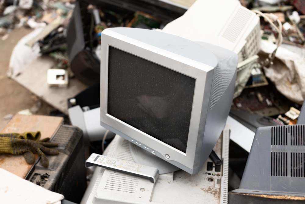 How to Dispose Old Computer Equipment - This photo shows several old computer monitors being dumped.