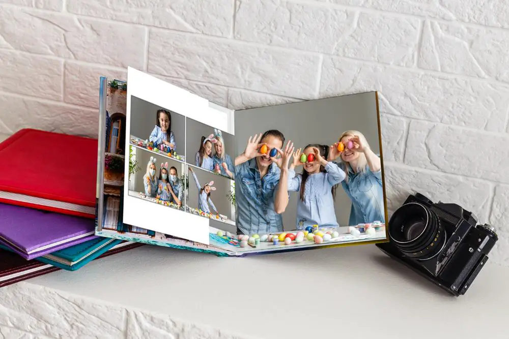 How to keep track of your photos - This photo shows a camera and a family photo album.