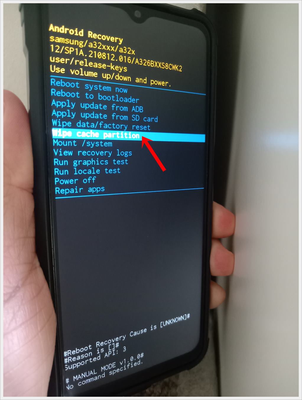 This photo shows an Android phone displaying the 'Android Recovery' screen, with the 'Wipe Cache Partition' option highlighted.