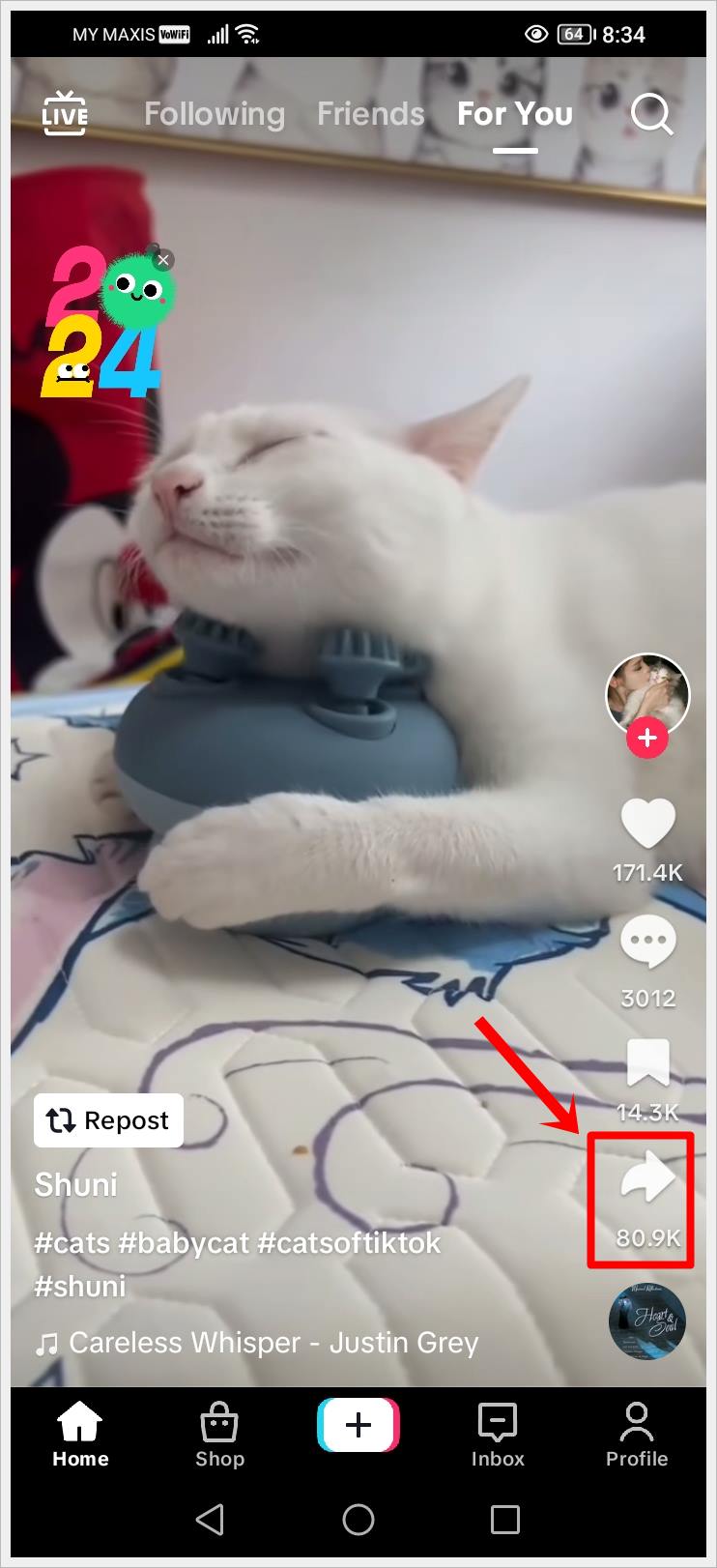 How to Download or Save TikTok Videos Easily: This image displays a screenshot of a TikTok 'For You' page, featuring a playing video. The 'Share' icon on the side of the video is highlighted.