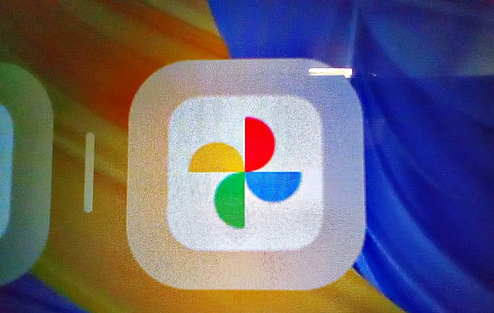 Explore How to Check the Number of Photos You Have in Google Photos. This photo shows a zoom-in of the Google Photos logo on a digital screen.