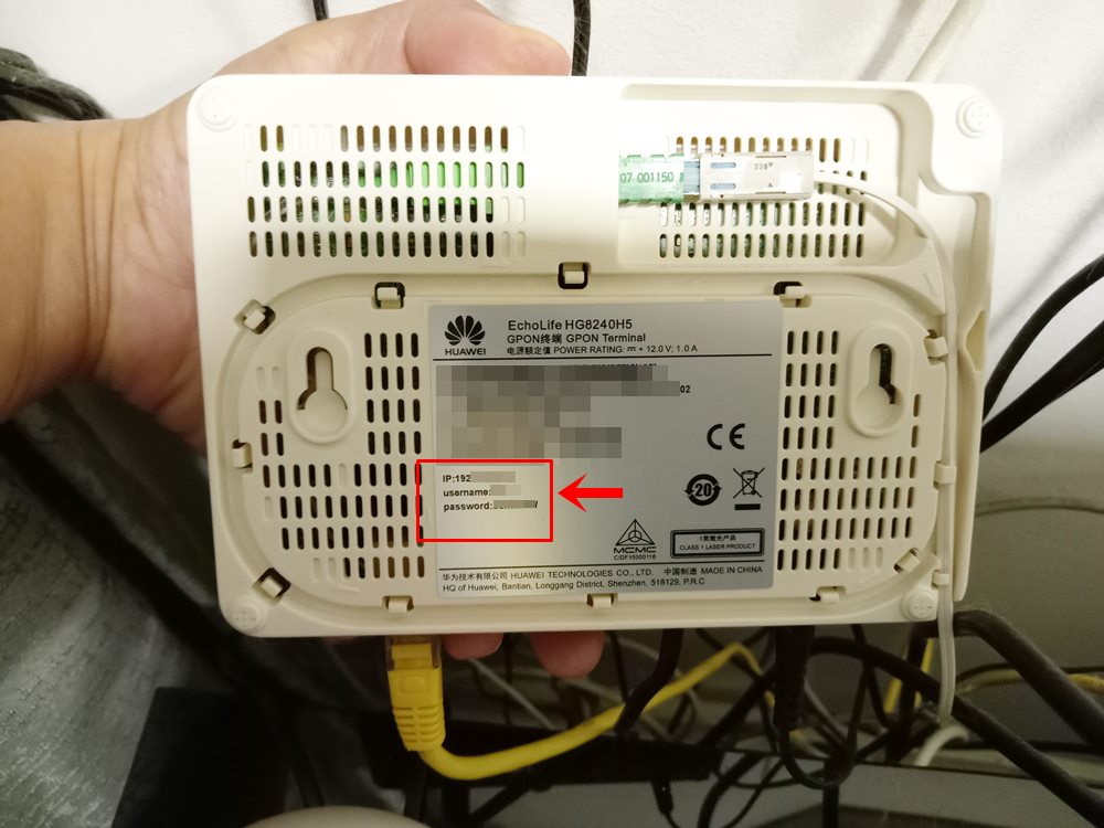 How to Reset Wi-Fi Password: This photo depicts the bottom of a router with its IP address, username and password on the manufacturer's sticker highlighted.