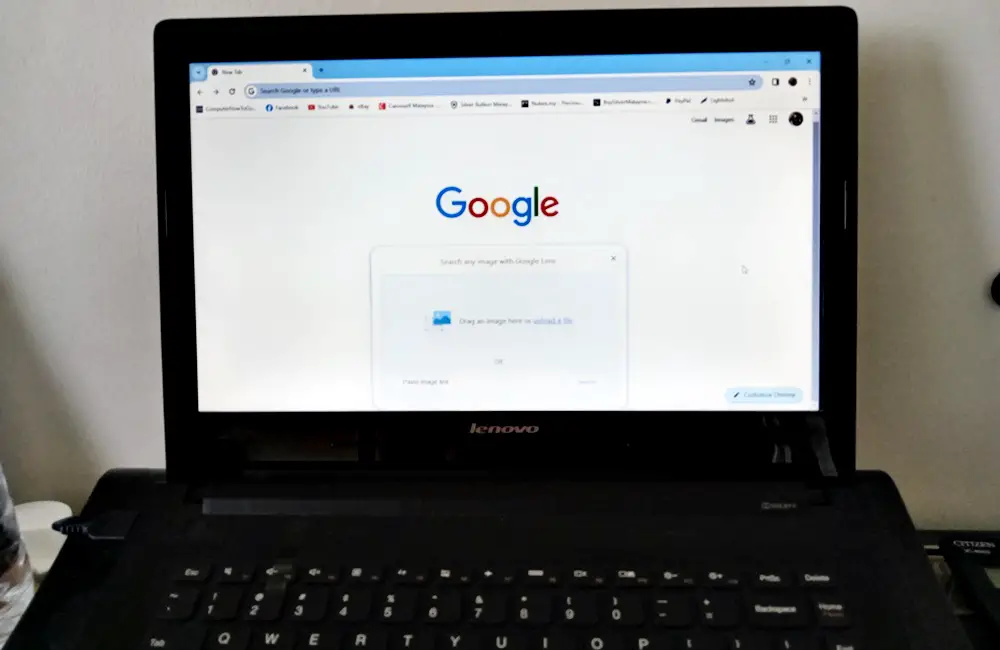 How to Find Similar Images: This photo depicts a laptop with its screen displaying Google's 'Search by Image' feature.