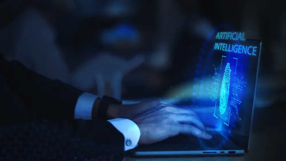 AI in Cyber Security: This photo depicts an individual accessing a laptop, with the screen displaying a thumbprint image and the word 'Artificial Intelligence'.