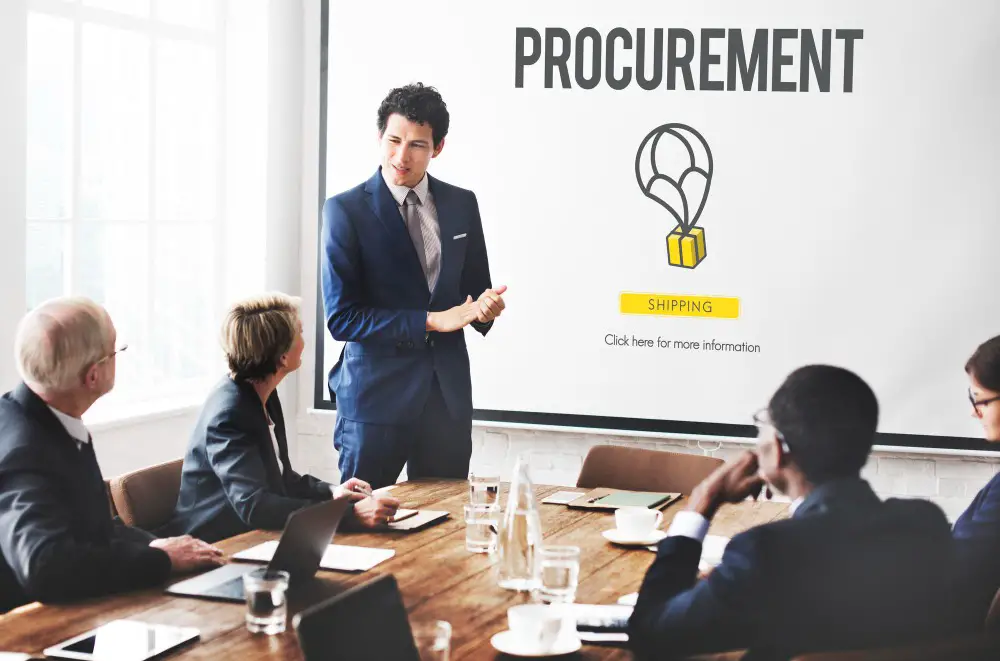 How to Implement Strategic Category Management in Procurement: This photo depicts a group of business professionals having a meeting about procurement in the office.