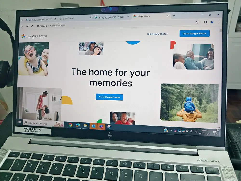 How to Select All Photos in Google Photos [Desktop and Mobile]: This photo depicts a laptop with its screen featuring the Google Photos "About" page.