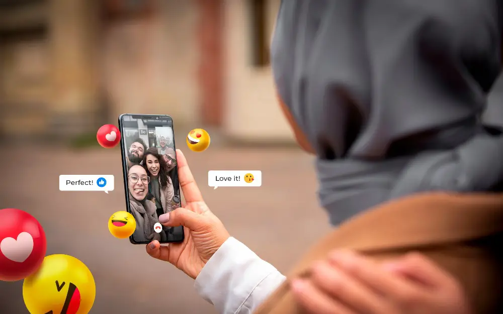 This photo depicts an individual engaging with her audience on a social media platform using a smartphone.