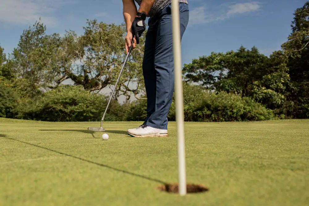 How Technology Is Transforming Golf Turf Management: This photo shows a golfer playing at a golf course.