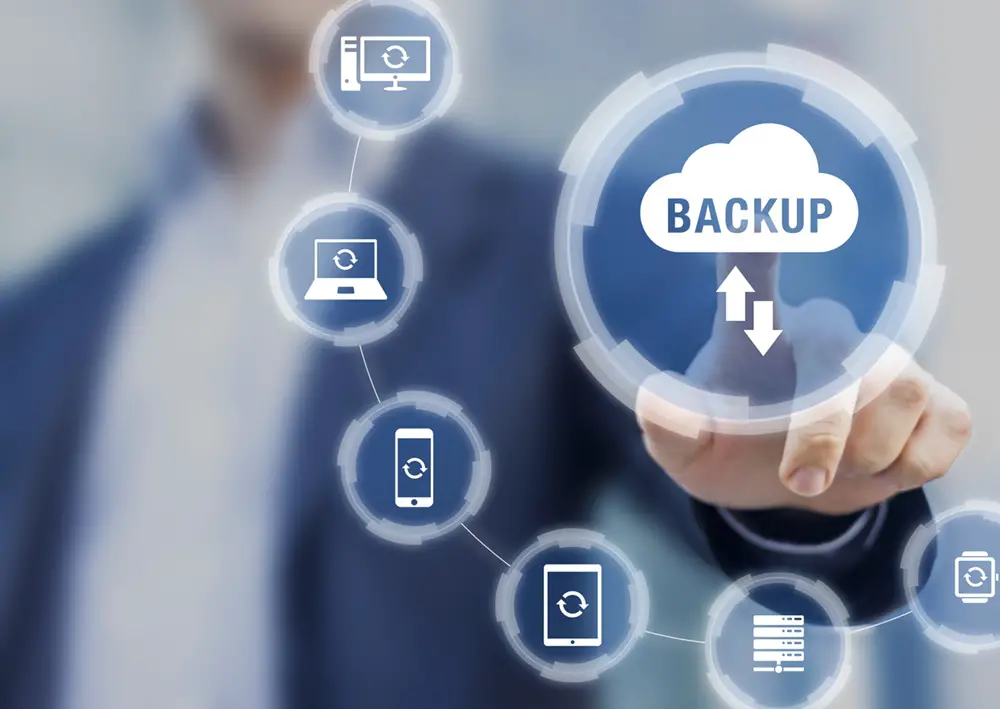 The image depicts cloud storage technology safeguarding business data across devices, ensuring connectivity and protection against loss.